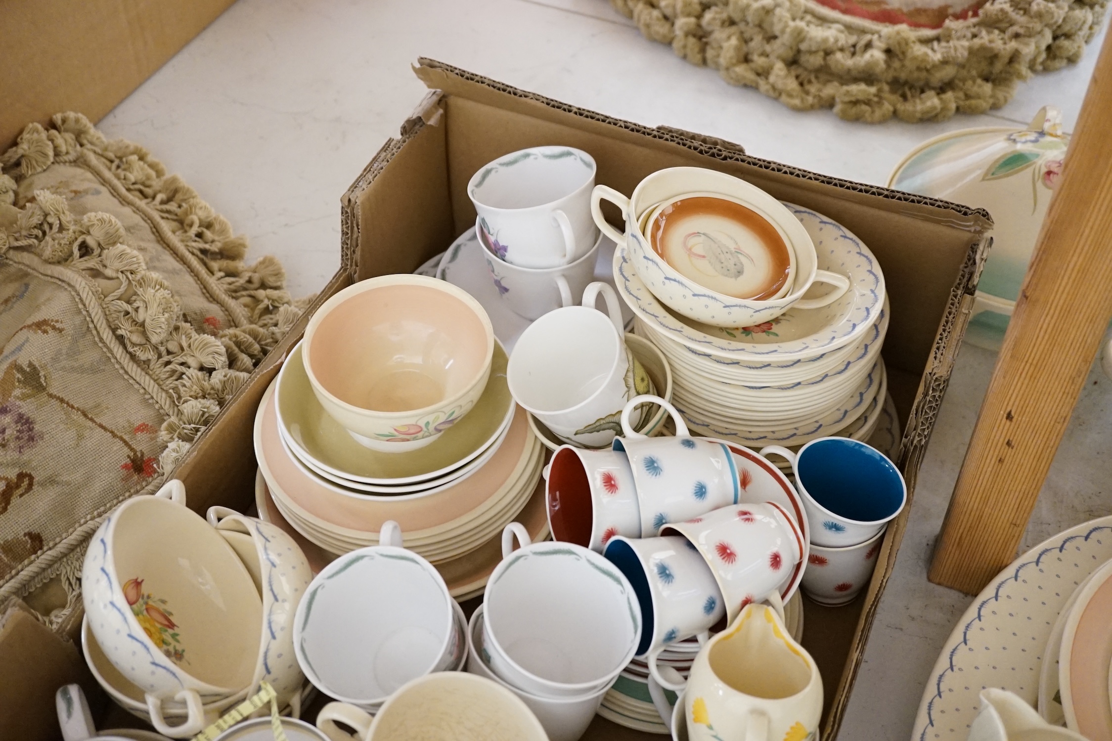 A collection of Susie Cooper ceramics and tablewares including tureens, an oval platter, cups and saucers